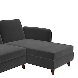 Resolving to keep your home neat and tidy for the upcoming year? Well, the Novogratz Perry Sectional Futon with Storage is exactly the classic multi-functional piece of furniture that you need to stay organized! Featuring slightly curved contouring along the armrests and upholstery in your choice of lush gray velvet or rich faux camel leather, the sofa exudes a thoroughly modern style and tone. Devised for compact living room or basement den areas, the chaise can be configured on either side of the futon and includes a large storage compartment to hide all of your stuff. Also, the adjustable backrest reclines to convert the couch into a comfortable and super convenient sleeper bed for visiting family or friends. Designed with longevity in mind, the Perry has been constructed with a durable wood frame that sits upon robust dark wood legs. Let the multi-purpose Perry re-define your space. Now that’s what we call a New Year’s solution!Soft curves and modern conventional style blend to create a sophisticated living room centerpiece. | Sectional futon with reclining backrest, interchangeable chaise and roomy storage compartment. Multi-functional piece turns into a sleeper bed to accommodate guests. Ideal for small spaces. | Crafted with robust wood frame and legs.  Offered in decadent camel faux leather or luxurious gray velvet upholstery.