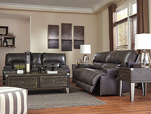 Sink into the supple McCaskill reclining loveseat and prepare to be swept off your feet—literally. Extra-wide seats and plush cushioning are divinely comfortable. The seating area is wrapped in our decadently soft leather for a luxurious experience, while a perfect leather-match upholstery on the exterior saves you money without sacrificing style. Prominent stitching, linear track arms and a goes-with-anything gray hue add stylish touches. Keep beverages and remotes close at hand thanks to the center console and cup holders.Dual-sided recliner | One-touch power control recliner with adjustable positions | Lift-top storage console and 2 cup holders | Corner-blocked frame with metal reinforced seats | Attached back and seat cushions | High-resiliency foam cushions wrapped in thick poly fiber | Leather interior upholstery; polyester/vinyl exterior upholstery | Power cord included; UL Listed