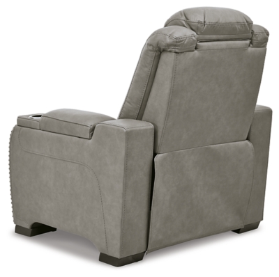 Reserved for him and made for her, The Man-Den power recliner in gray delivers all the comfort and style you could ask for. Inspired by sports car interiors, the seating area is covered in real leather for your pleasure, with a “perforated automotive” treatment for that much more appeal. Positioned at your fingertips, the advanced one-touch power control puts you in the driver’s seat with everything from an Easy View™ power headrest and power lumbar support, to a USB port and wireless charging for your phone. And with an integrated cup holder and hidden storage compartments under the posh, padded armrests, this designer power recliner makes the most of every inch of space.One-touch power control with Easy View™ power adjustable headrest, power lumbar support, USB charging and wireless phone charging | Wireless charger accommodates later model smartphones, including Apple iPhone, Samsung Galaxy, Huawei Mate and Nokia Lumia | Corner-blocked frame with metal reinforced seat | Attached cushions | 43" high back | High-resiliency foam cushions wrapped in thick poly fiber | Leather interior upholstery (with perforated details); vinyl/polyester exterior upholstery | Each armrest includes storage compartment | Cup holder (with 2 layers to accommodate drink containers) | Extended ottoman for enhanced comfort | Nailhead trim | Power cord included; UL Listed | Estimated Assembly Time: 15 Minutes