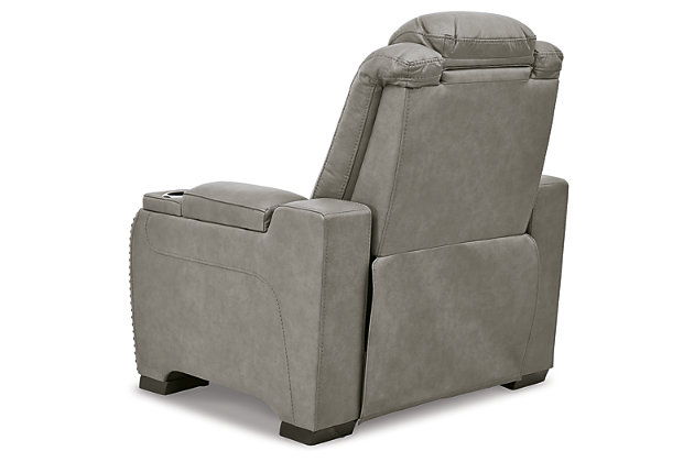 Reserved for him and made for her, The Man-Den power recliner in gray delivers all the comfort and style you could ask for. Inspired by sports car interiors, the seating area is covered in real leather for your pleasure, with a “perforated automotive” treatment for that much more appeal. Positioned at your fingertips, the advanced one-touch power control puts you in the driver’s seat with everything from an Easy View™ power headrest and power lumbar support, to a USB port and wireless charging for your phone. And with an integrated cup holder and hidden storage compartments under the posh, padded armrests, this designer power recliner makes the most of every inch of space.One-touch power control with Easy View™ power adjustable headrest, power lumbar support, USB charging and wireless phone charging | Wireless charger accommodates later model smartphones, including Apple iPhone, Samsung Galaxy, Huawei Mate and Nokia Lumia | Corner-blocked frame with metal reinforced seat | Attached cushions | 43" high back | High-resiliency foam cushions wrapped in thick poly fiber | Leather interior upholstery (with perforated details); vinyl/polyester exterior upholstery | Each armrest includes storage compartment | Cup holder (with 2 layers to accommodate drink containers) | Extended ottoman for enhanced comfort | Nailhead trim | Power cord included; UL Listed | Estimated Assembly Time: 15 Minutes