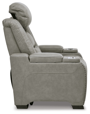 Reserved for him and made for her, The Man-Den power recliner in gray delivers all the comfort and style you could ask for. Inspired by sports car interiors, the seating area is covered in real leather for your pleasure, with a “perforated automotive” treatment for that much more appeal. Positioned at your fingertips, the advanced one-touch power control puts you in the driver’s seat with everything from an Easy View™ power headrest and power lumbar support, to a USB port and wireless charging for your phone. And with an integrated cup holder and hidden storage compartments under the posh, padded armrests, this designer power recliner makes the most of every inch of space.One-touch power control with Easy View™ power adjustable headrest, power lumbar support, USB charging and wireless phone charging | Wireless charger accommodates later model smartphones, including Apple iPhone, Samsung Galaxy, Huawei Mate and Nokia Lumia | Corner-blocked frame with metal reinforced seat | Attached cushions | 43" high back | High-resiliency foam cushions wrapped in thick poly fiber | Leather interior upholstery (with perforated details); vinyl/polyester exterior upholstery | Each armrest includes storage compartment | Cup holder (with 2 layers to accommodate drink containers) | Extended ottoman for enhanced comfort | Nailhead trim | Power cord included; UL Listed | Estimated Assembly Time: 15 Minutes