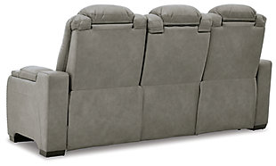 Reserved for him and made for her, The Man-Den power reclining sofa in gray delivers all the comfort and style you could ask for. Inspired by sports car interiors, the seating area is covered in real leather for your pleasure, with a “perforated automotive” treatment for that much more appeal. Positioned at your fingertips, the advanced one-touch power control puts you in the driver’s seat with everything from an Easy View™ power headrest and power lumbar support, to a USB port and wireless charging for your phone. Talk about fully loaded. The middle seat reveals a pull-down table with dimmable reading lights and cup holders. And with integrated cup holders and hidden storage compartments under the posh, padded armrests, this designer power reclining sofa makes the most of every inch of space.Dual-sided recliner | One-touch power control with Easy View™ power adjustable headrest, power lumbar support, USB charging and wireless phone charging | Wireless charger accommodates later model smartphones, including Apple iPhone, Samsung Galaxy, Huawei Mate and Nokia Lumia | Corner-blocked frame with metal reinforced seat | Attached cushions | 43" high back | High-resiliency foam cushions wrapped in thick poly fiber | Leather interior upholstery (with perforated details); vinyl/polyester exterior upholstery | Pull-down table with 2 cup holders (with 2 layers to accommodate drink containers) dimmable reading lights and magazine storage | Each armrest includes storage compartment | Extended ottoman for enhanced comfort | Nailhead trim | Power cord included; UL Listed | Estimated Assembly Time: 15 Minutes