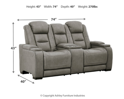 Reserved for him and made for her, The Man-Den power reclining loveseat in gray delivers all the comfort and style you could ask for. Inspired by sports car interiors, the seating area is covered in real leather for your pleasure, with a “perforated automotive” treatment for that much more appeal. Positioned at your fingertips, the advanced one-touch power control puts you in the driver’s seat with everything from an Easy View™ power headrest and power lumbar support, to a USB port and wireless charging for your phone. Talk about fully loaded. And with integrated cup holders and hidden storage compartments under the posh, padded armrests, this designer power reclining loveseat makes the most of every inch of space.Dual-sided recliner | One-touch power control with Easy View™ power adjustable headrest, power lumbar support, USB charging and wireless phone charging | Wireless charger accommodates later model smartphones, including Apple iPhone, Samsung Galaxy, Huawei Mate and Nokia Lumia | Corner-blocked frame with metal reinforced seat | Attached cushions | 43" high back | High-resiliency foam cushions wrapped in thick poly fiber | Leather interior upholstery (with perforated details); vinyl/polyester exterior upholstery | Storage console with 2 cup holders (with 2 layers to accommodate drink containers) | Each armrest includes storage compartment | Extended ottoman for enhanced comfort | Nailhead trim | Power cord included; UL Listed | Estimated Assembly Time: 15 Minutes