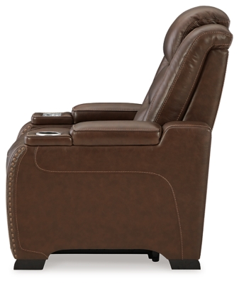 Reserved for him and made for her, this mahogany hued power recliner delivers all the comfort and style you could ask for. Inspired by sports car interiors, the Man-Den power recliner features real leather in the seating area for your pleasure. The advanced one-touch power control puts you in the driver’s seat with an adjustable headrest and lumbar support, USB port and wireless charging for your phone, plus an integrated cup holder, all at your fingertips. This power recliner utilizes every inch of space, with hidden storage compartments under the padded armrests.One-touch power control with Easy View™ power adjustable headrest, power lumbar support, USB charging and wireless phone charging | Wireless charger accommodates later model smartphones, including Apple iPhone, Samsung Galaxy, Huawei Mate and Nokia Lumia | Corner-blocked frame with metal reinforced seat | Attached cushions | High-resiliency foam cushions wrapped in thick poly fiber | Leather interior upholstery (with perforated details); vinyl/polyester (faux leather) exterior upholstery | Armrest with storage compartment | 2 cup holders | 43" high back | Extended ottoman for enhanced comfort | Nailhead trim | Power cord included; UL Listed | Estimated Assembly Time: 15 Minutes