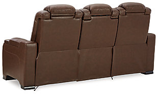 Reserved for him and made for her, this mahogany hued power reclining sofa delivers all the comfort and style you could ask for. Inspired by sports car interiors, the Man-Den power reclining sofa features real leather in the seating area for your pleasure with high-end accents for that much more appeal. The advanced one-touch power control puts you in the driver’s seat with an adjustable headrest and lumbar support, USB port and wireless charging for your phone, all at your fingertips. The pull-down table in the middle seat includes dimmable reading lights and integrated cup holders. This power recliner makes the most of every inch of space, with hidden storage compartments under the padded armrests.Dual-sided recliner | One-touch power control with Easy View™ power adjustable headrest, power lumbar support, USB charging and wireless phone charging | Wireless charger accommodates later model smartphones, including Apple iPhone, Samsung Galaxy, Huawei Mate and Nokia Lumia | Corner-blocked frame with metal reinforced seat | Attached cushions | High-resiliency foam cushions wrapped in thick poly fiber | Leather interior upholstery (with perforated details); vinyl/polyester exterior upholstery | Pull-down table with 2 cup holders, dimmable reading lights and magazine storage | 43" high back | Armrest with storage compartment | Extended ottoman for enhanced comfort | Nailhead trim | Power cord included; UL Listed | Estimated Assembly Time: 15 Minutes