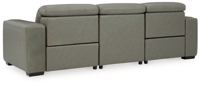 Truly putting high design into recline, the Correze power sofa with genuine leather seating area proves that just because you’re a recliner doesn’t mean you have to look like one. Deceptively beautiful, its ultra clean-lined aesthetic is as cool and contemporary as they come. Low-profile back has a super swank look. When you need more support for your head and neck, the press of a button engages the Easy View™ power adjustable headrest, designed to let you lean back and still have a primo view of the TV. Ever-so-subtle curves and stunning stitching perfect the aesthetic.Includes 3 pieces: armless chair, left-arm facing zero wall power recliner and right-arm facing zero wall power recliner | One-touch power control with adjustable positions, Easy View™ adjustable headrest and zero-draw USB plug-in | Zero-draw technology only consumes power when the USB receptacle is in use | Zero wall design requires minimal space between wall and chair back | Corner-blocked frame with metal reinforced seat | Attached back and seat cushions | High-resiliency foam cushions wrapped in thick poly fiber | Extended ottoman for enhanced comfort | Leather interior upholstery; vinyl/polyester exterior upholstery    | Power cord included; UL Listed | Exposed feet with faux wood finish | "Left-arm" and "right-arm" describe the position of the arm when you face the piece | Estimated Assembly Time: 55 Minutes