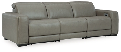 Truly putting high design into recline, the Correze power sofa with genuine leather seating area proves that just because you’re a recliner doesn’t mean you have to look like one. Deceptively beautiful, its ultra clean-lined aesthetic is as cool and contemporary as they come. Low-profile back has a super swank look. When you need more support for your head and neck, the press of a button engages the Easy View™ power adjustable headrest, designed to let you lean back and still have a primo view of the TV. Ever-so-subtle curves and stunning stitching perfect the aesthetic.Includes 3 pieces: armless chair, left-arm facing zero wall power recliner and right-arm facing zero wall power recliner | One-touch power control with adjustable positions, Easy View™ adjustable headrest and zero-draw USB plug-in | Zero-draw technology only consumes power when the USB receptacle is in use | Zero wall design requires minimal space between wall and chair back | Corner-blocked frame with metal reinforced seat | Attached back and seat cushions | High-resiliency foam cushions wrapped in thick poly fiber | Extended ottoman for enhanced comfort | Leather interior upholstery; vinyl/polyester exterior upholstery    | Power cord included; UL Listed | Exposed feet with faux wood finish | "Left-arm" and "right-arm" describe the position of the arm when you face the piece | Estimated Assembly Time: 55 Minutes