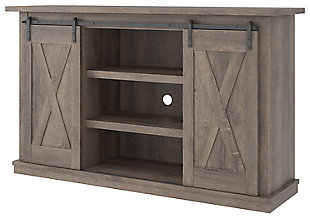 With its replicated weathered oak finish, cross-buck details and authentic charm, the Arlenbry TV stand is right in tune with your relaxed approach to high style. Beautifully made to accommodate your media equipment, it’s well equipped with adjustable shelving, cutouts for wire management and, of course, a pair of sliding barn doors you can center or place to the side. What a mastery in modern farmhouse living.Made of engineered wood and decorative laminate | Replicated weathered oak grain | Metal brackets and hardware | 2 adjustable center shelves; 4 side shelves | Pair of sliding barn doors | Cross-buck details | Cutouts for wire management | Assembly required | Estimated Assembly Time: 90 Minutes