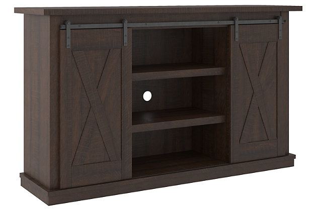 With its replicated burnt umber rustic wood grain and minimalist charm, the Camiburg TV stand is right in tune with your relaxed approach to high style. Beautifully made to accommodate your media equipment, it’s well equipped with adjustable shelving, cutouts for wire management and a sliding barn door for that modern farmhouse look you love.Made with engineered wood and decorative laminate | Replicated burnt umber rustic wood grain | 2 adjustable center shelves; 4 side shelves | Cutouts for wire management | Assembly required | Estimated Assembly Time: 45 Minutes