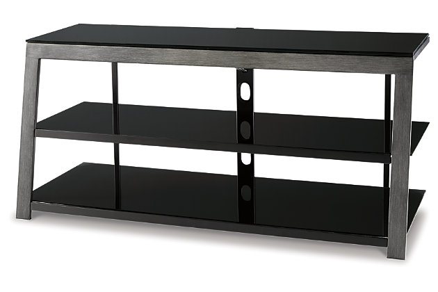 For those who appreciate open-concept design, the Rollynx TV stand is beautifully in tune. Cool and contemporary, this TV stand really steps it up with cantilever styling and a two-tone finish that blends an aged silvertone metal frame with sleek black glass shelves. A wire management support bar helps maximize the minimalism.Made of metal and glass | Wire management support bar | Fixed center shelf | Assembly required | Excluded from promotional discounts and coupons | Estimated Assembly Time: 30 Minutes