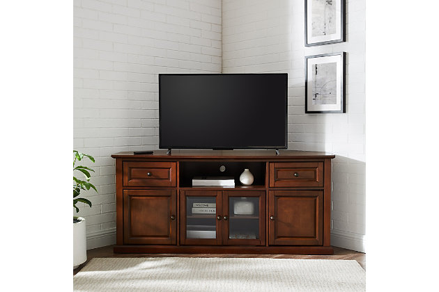 The ideal tv unit for coastal and country interiors, this pine piece in distressed white finish has natural rattan baskets with cutout handles to make finding all entertainment essentials a breeze. A pretty organization solution for condo or cottage.Made of solid hardwood, wood veneer and glass | Hand-rubbed mahogany finish | Antiqued brass-tone hardware | Cutouts for wire management | Assembly required