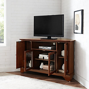 Enhance your living space with this impeccably crafted corner tv stand. This signature cabinet accommodates most 52" flat panel tvs and is handsomely proportioned featuring character-rich details sure to impress. The hand rubbed, multi-step finish with genuine metal hardware is perfect for blending with the family of furniture that is already part of your home. Raised panel doors strategically conceal stacks of cd/dvds and various media paraphernalia. Tempered beveled glass doors not only add a touch of class but they protect those valued electronic components, while allowing for complete use of remote controls. The open storage area generously houses media players and the like. Adjustable shelving offers an abundance of versatility to effortlessly organize by design, while cord management tames the unsightly mess of tangled wires. Style, function and quality make this cabinet a wise choice for your home furnishings needs.Made of solid hardwood, wood veneer and beveled glass | Mahogany hand-rubbed finish | Antiqued brass-tone hardware | 4 doors open to reveal 4 adjustable shelves | Cutouts for wire management | Assembly required