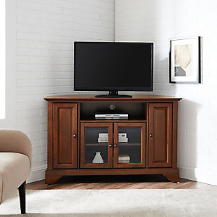 Enhance your living space with this impeccably crafted corner tv stand. This signature cabinet accommodates most 52" flat panel tvs and is handsomely proportioned featuring character-rich details sure to impress. The hand rubbed, multi-step finish with genuine metal hardware is perfect for blending with the family of furniture that is already part of your home. Raised panel doors strategically conceal stacks of cd/dvds and various media paraphernalia. Tempered beveled glass doors not only add a touch of class but they protect those valued electronic components, while allowing for complete use of remote controls. The open storage area generously houses media players and the like. Adjustable shelving offers an abundance of versatility to effortlessly organize by design, while cord management tames the unsightly mess of tangled wires. Style, function and quality make this cabinet a wise choice for your home furnishings needs.Made of solid hardwood, wood veneer and beveled glass | Mahogany hand-rubbed finish | Antiqued brass-tone hardware | 4 doors open to reveal 4 adjustable shelves | Cutouts for wire management | Assembly required