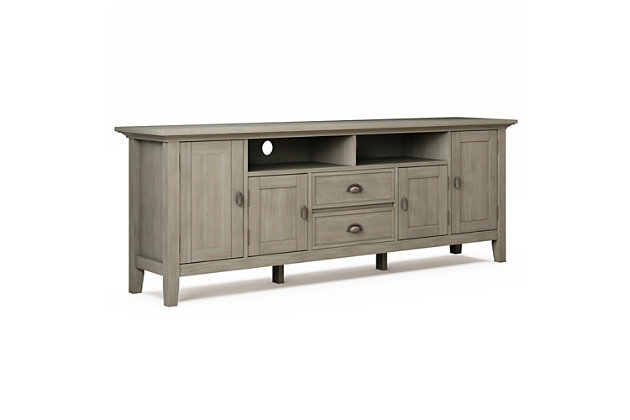 This rustic, extra-wide TV stand with Shaker-style doors makes a stylish and functional base for your home entertainment system. Crafted of solid wood, it features both open and closed storage options, elegantly tapered legs and a tabletop with crown-edged moulding. The media stand is perfectly sized for TVs up to 80 inches, with plenty of storage space for all your media and gaming devices.DIMENSIONS: 16.5" D x 72" W x 26" H | Handcrafted with care using the finest quality solid wood | Hand-finished in Distressed Grey with a protective NC lacquer to accentuate and highlight the grain and the uniqueness of each piece of furniture | Features a large centrally located open area with two open spaces, two (2) drawers as well as two (2) framed doors with enclosed spaces; the two (2) large side storage cabinets open to one (1) adjustable shelf each. | Extra wide TV Stand is perfect for TVs up to 80 inches includes cord management cut-outs for easy installation of TV and media components | Transitional Style includes molded crown edged table top and Antique Brass pulls and knobs | Assembly Required | We believe in creating excellent, high quality products made from the finest materials at an affordable price. Every one of our products come with a 1-year warranty and easy returns if you are not satisfied. | Weight capacity 220 lbs. | Cutouts for cord management | Assembly required