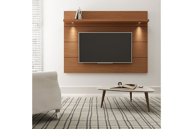 Maximize space in your living room with the Cabrini Floating Wall TV Panel 1.8 in maple cream. It includes brackets for mounting flat-screen TVs up to 60 inches on the panel to free up floor space and minimize clutter. Two overhead LED lights create a cozy and homey atmosphere in your living room. Pair it with our Cabrini TV Stand to create a complete home theater. Choose between modern finishes to complement your decor.Made with engineered wood | Accommodates most flat-screen tvs up to 60" | Brown/beige | Features 1 overhead shelf for picture frames and collectibles | Includes  brackets to mount tv on panel | Includes a media hole to conceal tv cord | Unique finishes allow for easy cleaning; paint protected by microban antibacterial protection | Some assembly required (all hardware included)