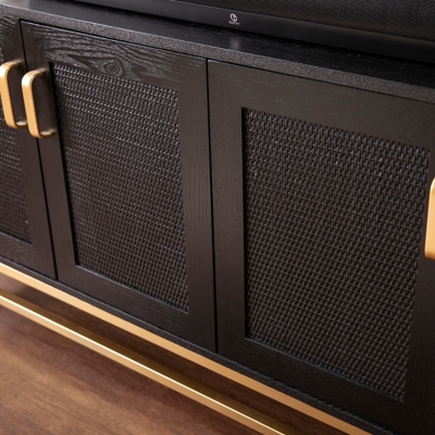 Close-up of the textured woven cabinet panel and gold handle