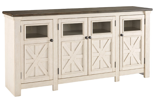 Whether your style is farmhouse fresh, shabby chic or country cottage, you’ll find the Bolanburg extra large TV stand perfectly in tune. Its two-tone, gently distressed finish pairs weathered oak with antique white for that much more quaint character. Charming elements include crossbuck adorned cabinets with glass inlays for peek-through flair. Ample adjustable shelving and cutouts for wire management nicely accommodate your media needs.Made of veneers, wood and engineered wood | Two-tone finish (weathered oak top over antique white) | 2 side cabinets with 2 adjustable shelves each | 1 center cabinet with 2 doors and 2 adjustable shelves | Cabinet doors with glass inlays | Black faceted hardware | Cutouts for wire management | Assembly required | Estimated Assembly Time: 30 Minutes