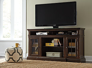 The beauty of the Roddinton TV stand will immediately engage you. The slight breakfront shape is a rare find and an ideal fit among traditional and eclectic tastes. Soft black undertones highlight the warm finish. Multiple cubbies and glass-door enclosed shelves organize your audio/video components and plenty of extras. Sold separately, an electric fireplace fits neatly in the center cubby.2 storage cubbies | Cutouts for wire management | Assembly required | 1 adjustable shelf | 2 cabinets with tempered glass doors and 1 adjustable shelf, each | Made of veneers, wood, engineered wood and marble | Breakfront moulding with natural marble inset | Compatible with W100-121 electric fireplace insert | Excluded from promotional discounts and coupons