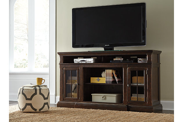The beauty of the Roddinton TV stand will immediately engage you. The slight breakfront shape is a rare find and an ideal fit among traditional and eclectic tastes. Soft black undertones highlight the warm finish. Multiple cubbies and glass-door enclosed shelves organize your audio/video components and plenty of extras. Sold separately, an electric fireplace fits neatly in the center cubby.2 storage cubbies | Cutouts for wire management | Assembly required | 1 adjustable shelf | 2 cabinets with tempered glass doors and 1 adjustable shelf, each | Made of veneers, wood, engineered wood and marble | Breakfront moulding with natural marble inset | Compatible with W100-121 electric fireplace insert | Excluded from promotional discounts and coupons