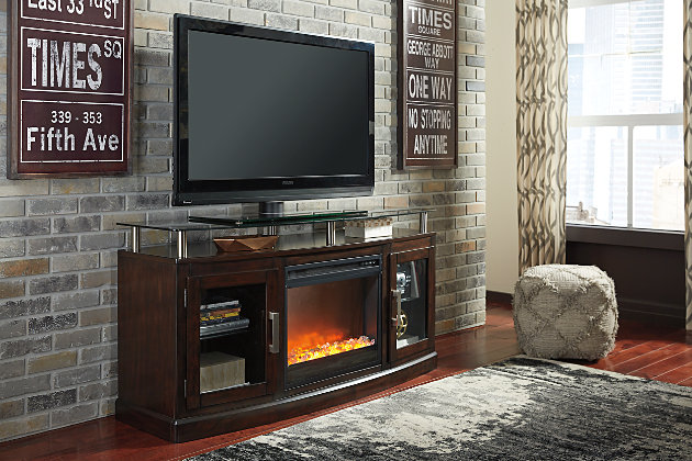 Enjoy the cozy feel of a cracklin’ fireplace without the hassle, maintenance or cleanup. Available as an addition on select TV stands and entertainment centers, this fireplace insert includes an electric flame feature that operates with or without heat, six-level temperature setting, five levels of brightness and remote control—along with an overheating control device for added safety. Faux crystals enhance the flickering flame; or mix in stones for a natural touch (all included).6-level temperature setting | 5 levels of flame brightness | 20-watt fan | LED-lit flame operates with or without heat | Fireplace provides up to 4608 BTU/1400W and warms up to 400 square feet (heats a mid-size room) | Faux glass and stones included | Overheating control device | Easy-clean filter | Remote control with LED display | UL Listed; power cord included | Assembly required