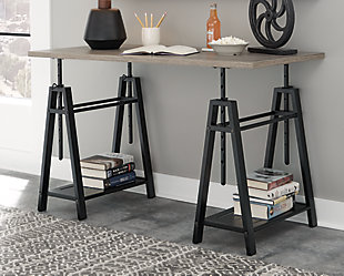 A look that’s sure to work wonders in your modern farmhouse, this sawhorse adjustable height desk is right on trend. Reclaimed finished top and industrial gray metal base make a cool combination. Whether you're sitting, standing, typing or crafting, you're sure to love the desk's unique 8-level adjustable height feature.Made of engineered wood and metal | Grayish brown wood finish; gunmetal finish base | 8 adjustable height options | 2 side shelves | Assembly required | Estimated Assembly Time: 30 Minutes