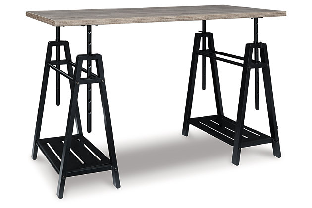 A look that’s sure to work wonders in your modern farmhouse, this sawhorse adjustable height desk is right on trend. Reclaimed finished top and industrial gray metal base make a cool combination. Whether you're sitting, standing, typing or crafting, you're sure to love the desk's unique 8-level adjustable height feature.Made of engineered wood and metal | Grayish brown wood finish; gunmetal finish base | 8 adjustable height options | 2 side shelves | Assembly required | Estimated Assembly Time: 30 Minutes